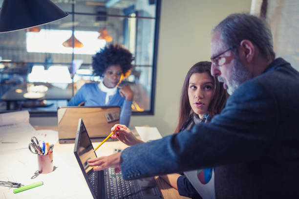 istock Team of architects working on a new business projects 1012363988
