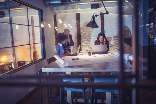 istock Team of architects working on a new business projects 1012364020