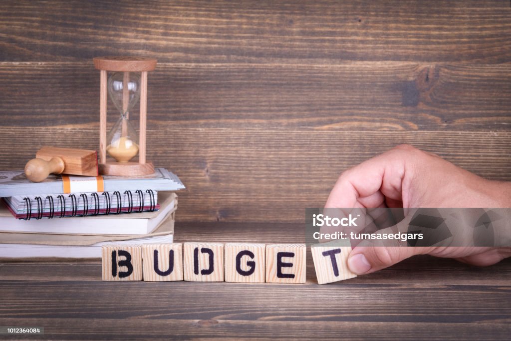 budget. wooden letters on the office desk budget. wooden letters on the office desk, informative and communication background Budget Stock Photo