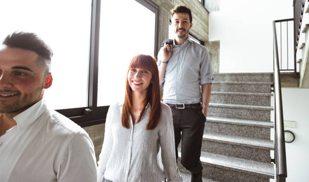istock friends colleagues descending the staircase 1012366988