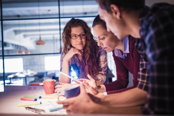 istock Group of young architects working together in architecture studio 1012367402