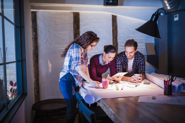 istock Group of young architects working together in architecture studio 1012367634