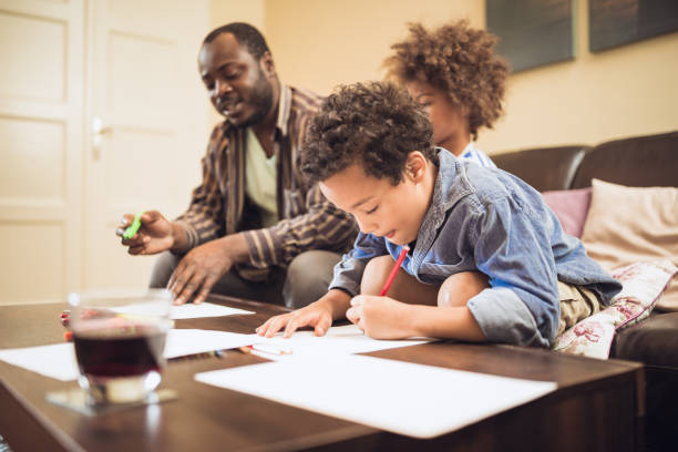 istock Kids having fun at home, playing with their father. 1012381282