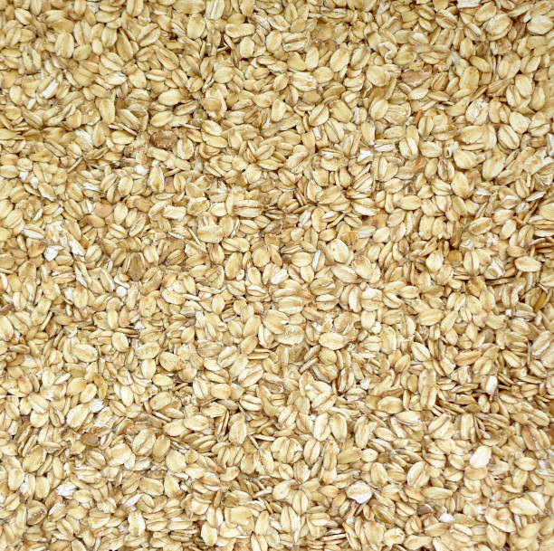 istock Even layer of raw oat groats texture 1012384848