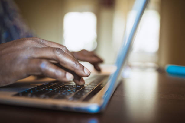 istock African men typing on keyboard, working at home 1012384976