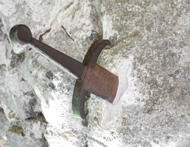 istock Ancient sword Excalibur in the stone 1012389686
