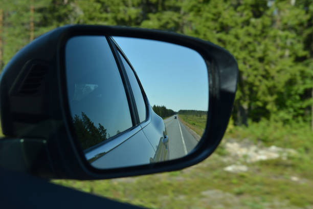 istock Road in car mirror. Speed 1012390272
