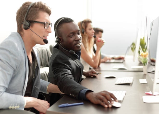 istock call center operators sitting at their Desk 1012390480