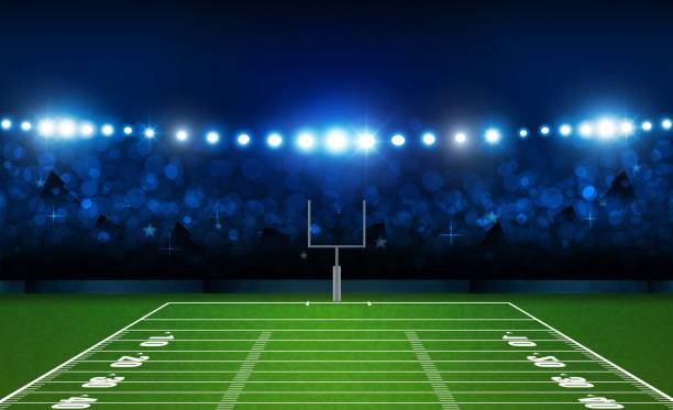 istock American football arena field with bright stadium lights design. Vector illumination 1012405180