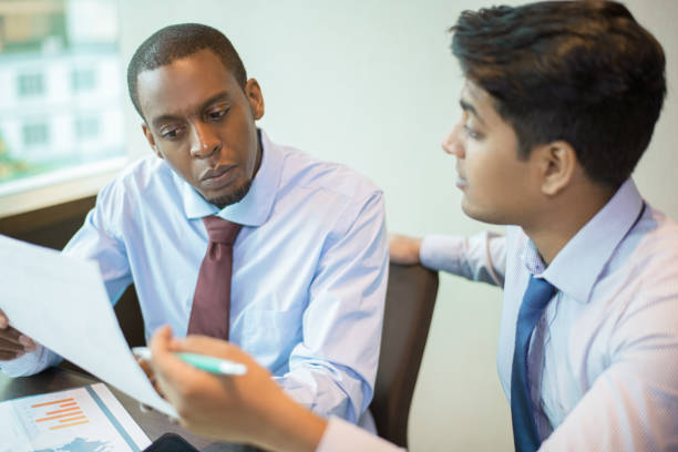 istock Serious business leader consulting financial advisor 1012407892