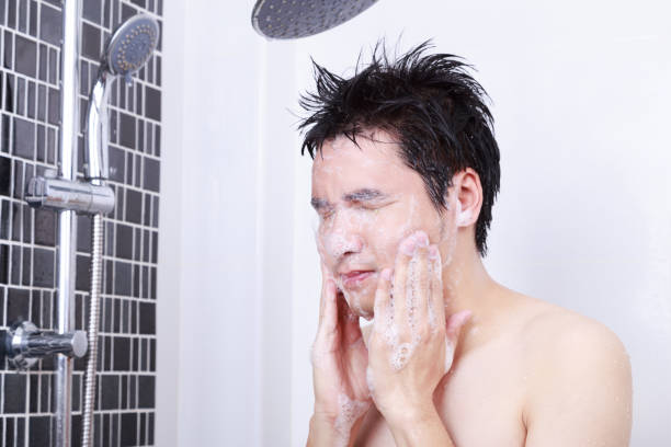 istock man washing face in the bathroom 1012408040