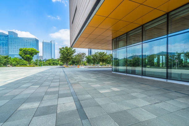istock Empty brick road nearby office building 1012408420