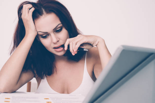 istock Pensive Charming Woman Working With Diagrams 1012416850