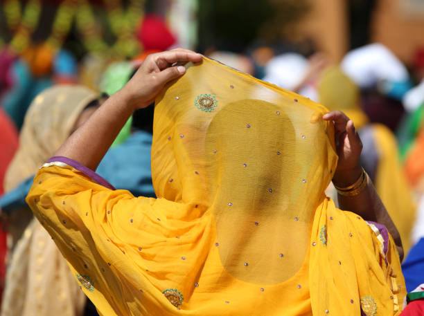 istock Sikh woman wearing an orange veil 1012417306
