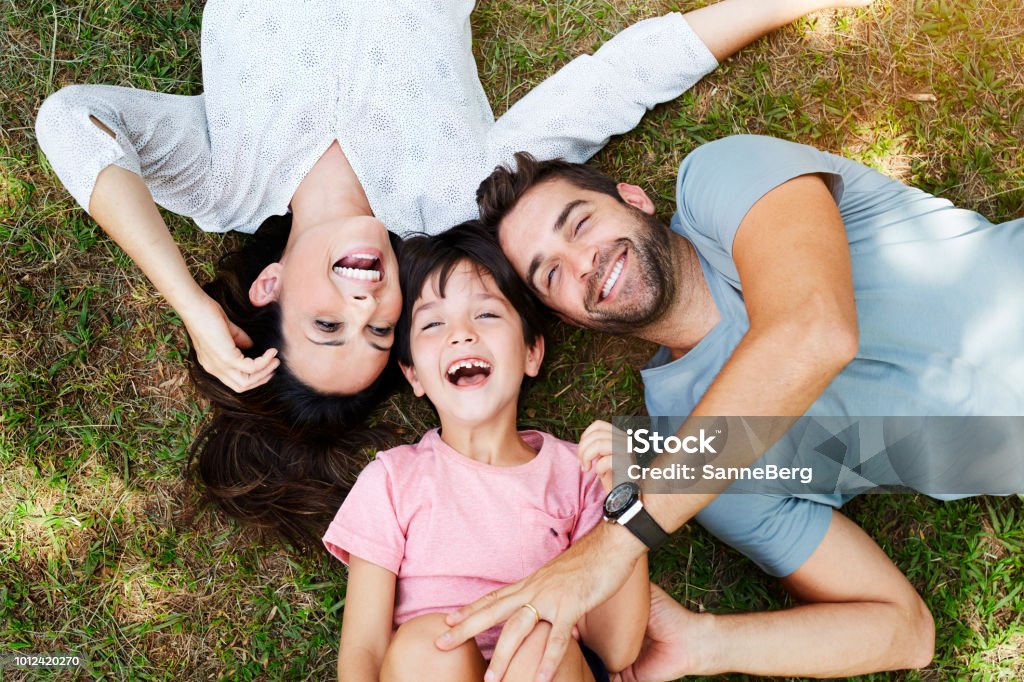 Family smiling Family smiling together in park Family Stock Photo