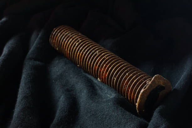 The yellow rusty on spiral and black background,Rust on the nut.