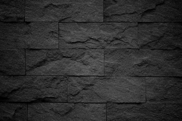 istock Dark grey black slate background or natural stone texture. 1012440060