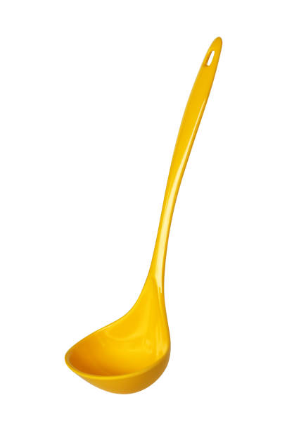 istock Yellow spoon isolated on white background 1012444788