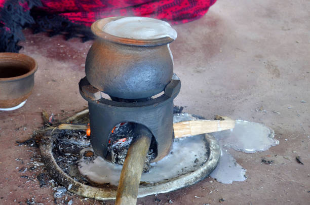 Tangalle, Sri Lanka - April 14, 2018: Buddhists and Hindus of Sri Lanka celebrate Avurudu, New Year's Day, by boiling milk in a new earthen pot and allowing it to boil over to bring prosperity.