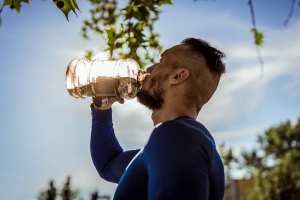 istock Young handsome tattooed man training hard outdoors 1012454954