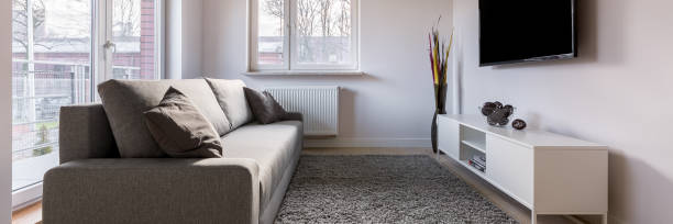 istock Tv living room with couch 1012456034