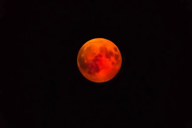 The blood moon over the Widderstein in the Kleinwalsertal in Austria