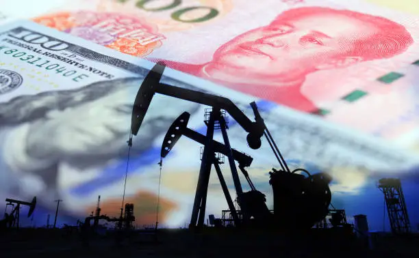 Dollars, yuan and oil pumps,Petroleum, petrodollar and crude oil concept, Oil pump on background of US dollar and RMB,