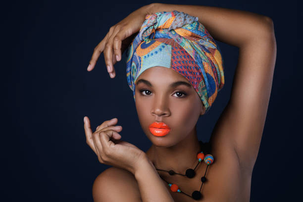 istock African woman with a colorful shawl on her head 1012470498