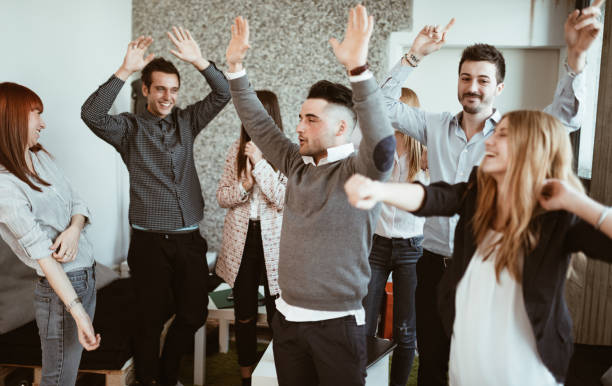 istock friends make a party at the office 1012470710