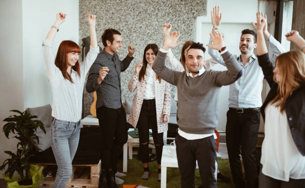 istock friends make a party at the office 1012470854