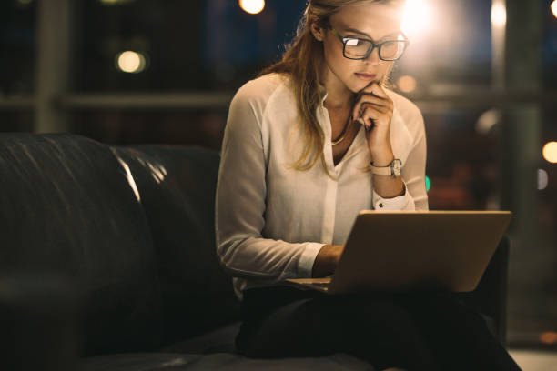 istock Female executive working late in office 1012475826