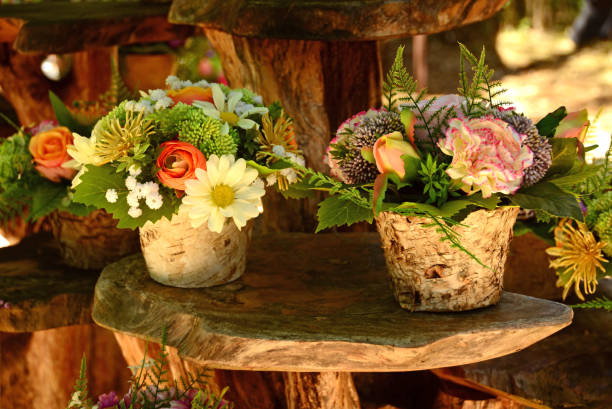 istock Two flower pots filled with imitation Flowers. 1012478144