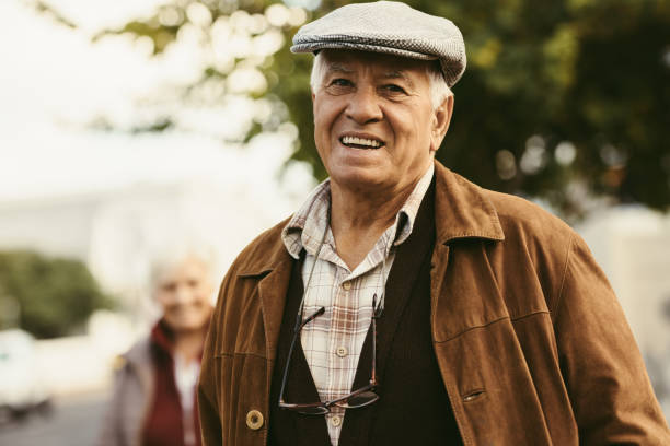 istock Retired man standing outside on a winter day 1012481430