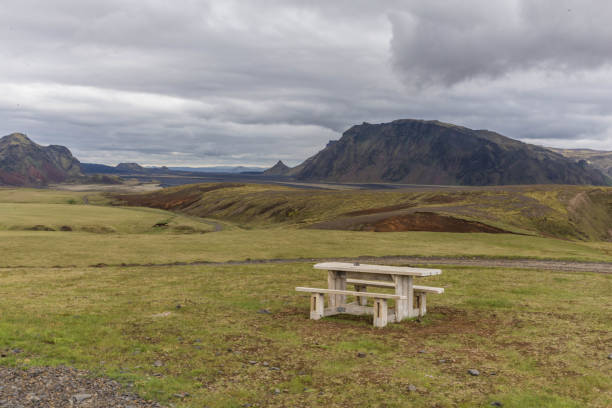 istock Volcanic landscape. Moss covered valley with camping spot 1012487248