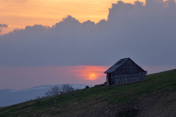 istock Wooden house on hill 1012491392