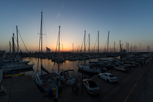 Barcelona, Spain, August 2017: yachts in marina of Porto Olimpico on early morning. Reflections on water