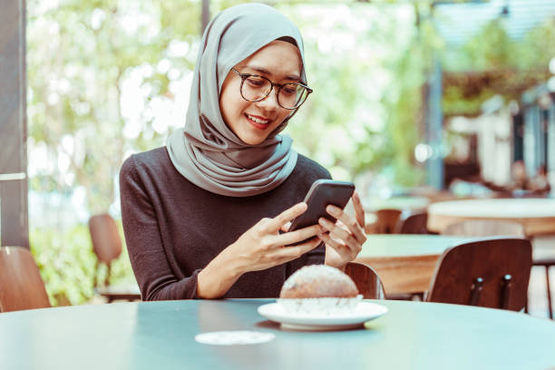 istock Young woman with smart phone 1012500742