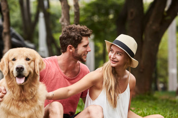 istock Smiling couple and dog 1012505054