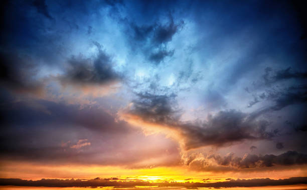 istock Dramatic sunset and sunrise sky. Orange, blue and yellow colors sunset. HDR effect. 1012505924