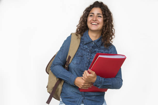 istock Young happy confident young student woman holding exercise books or folder. Education concept. Back to school concept. 1012507234