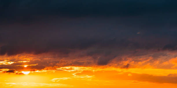 istock Sunrise Sunset Sunrise Sky. Bright Dramatic Sky With Clouds. Yellow, Orange, Blue And Magenta Colours 1012510536