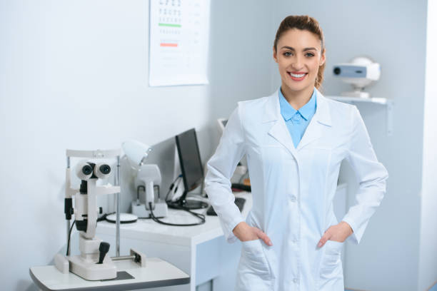 istock smiling female optometrist posing in optical clinic 1012510788
