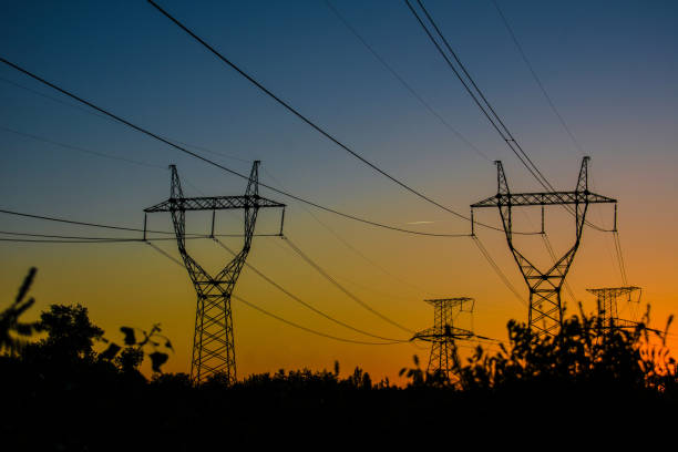 istock high-voltage power lines at sunset. electricity distribution station . 1012512944