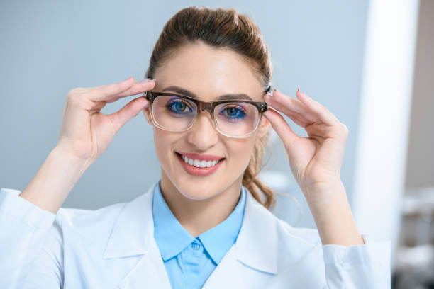 istock attractive smiling ophthalmologist wearing eyeglasses 1012513058
