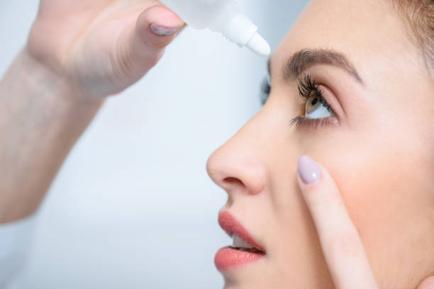 istock profile of beautiful woman dripping eye drops 1012513092