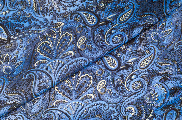 istock Background texture, Fabric blue paisley. Designed for Fabri-Quilt, this soft double napped  flannel is perfect for quilting, apparel, and home decor accents. Colors include black, blue, and white. 1012519168