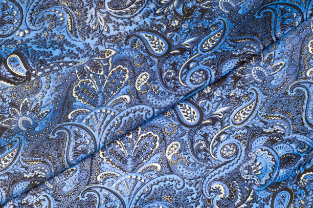 istock Background texture, Fabric blue paisley. Designed for Fabri-Quilt, this soft double napped  flannel is perfect for quilting, apparel, and home decor accents. Colors include black, blue, and white. 1012519254