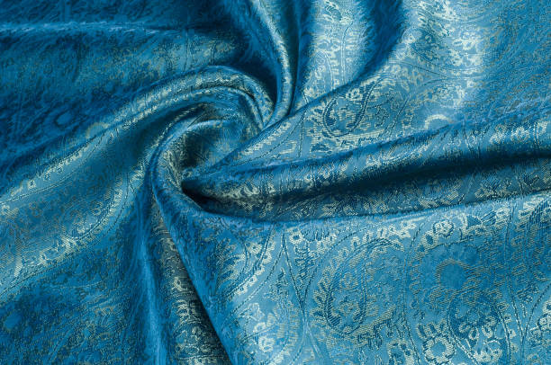 istock Background texture, pattern. Blue paisley silk chiffon mod fabric by the yard. Crinkled, flowy, soft, very light, 1012519586