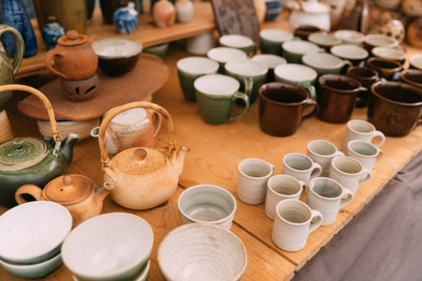 istock Ceramic Clay Crafts. Ceramic Dishware In Market. Bowls, Kettle, Cups. 1012523128
