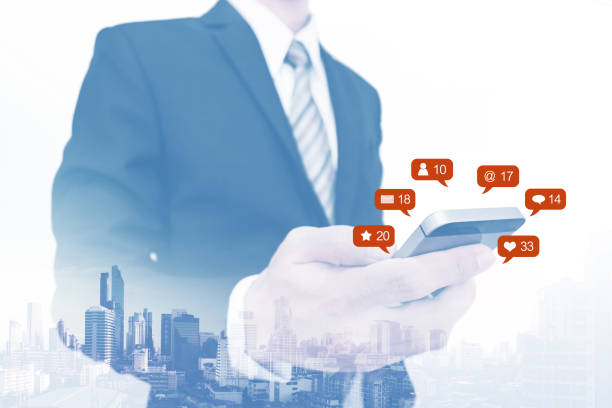 istock Double exposure, Businessman using mobile phone and notification icons 1012525722